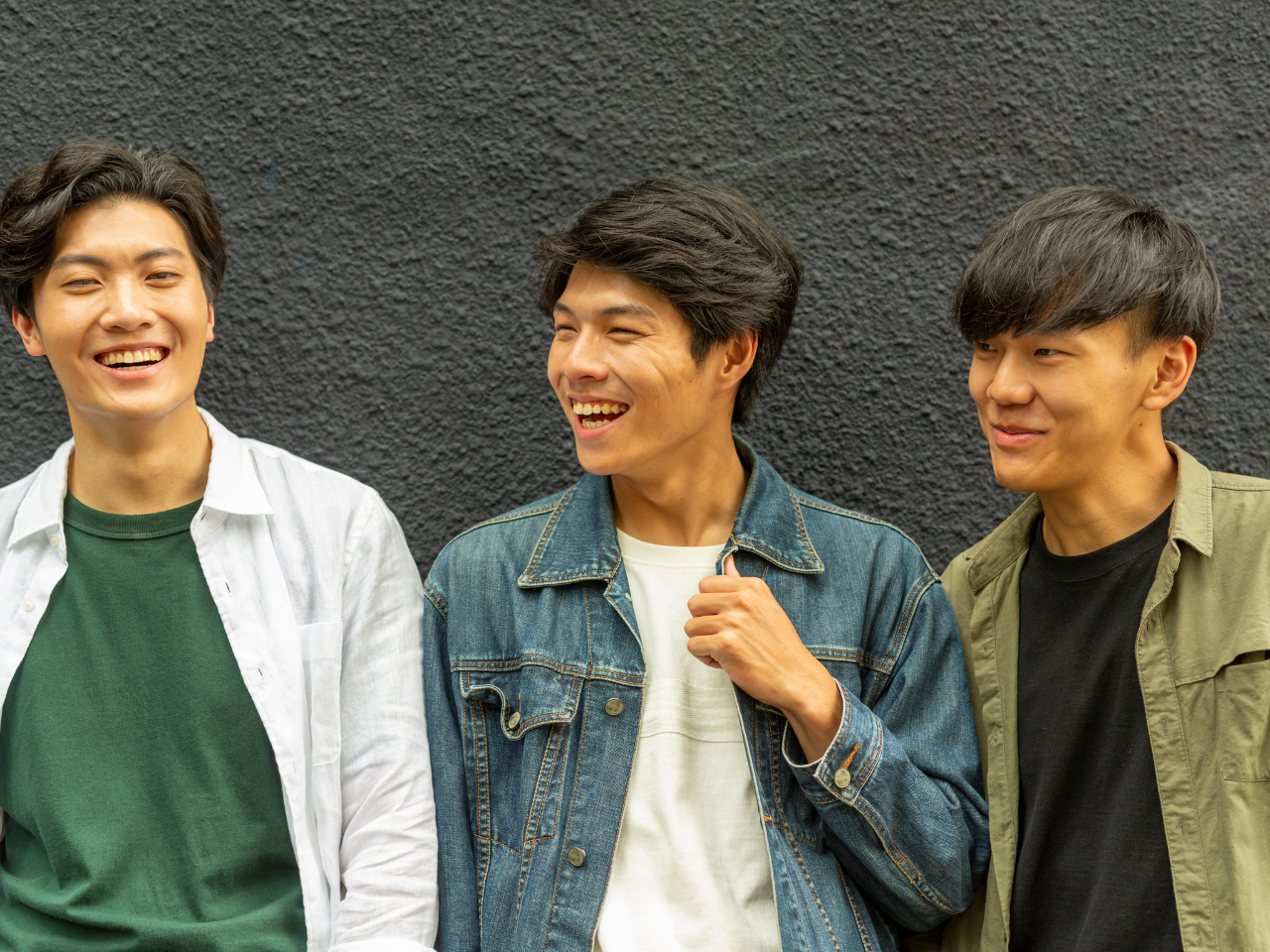 Three asian men smiling
