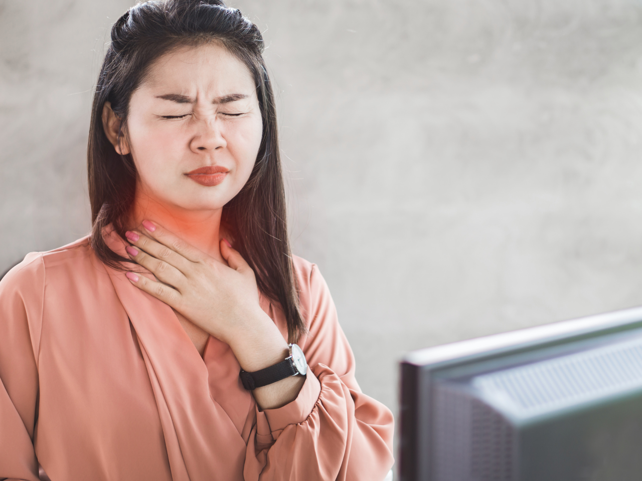 asian woman experiencing discomfort due to regurgitation caused by acid reflux